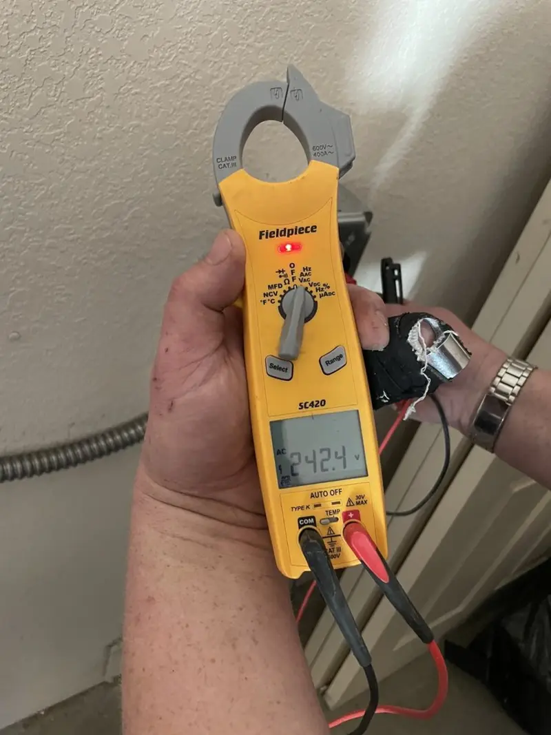Voltage testing with clamp meter during Ceiling Fan Installation in Goose Creek Village